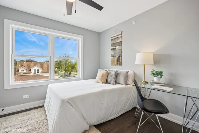 a bedroom with a bed and window