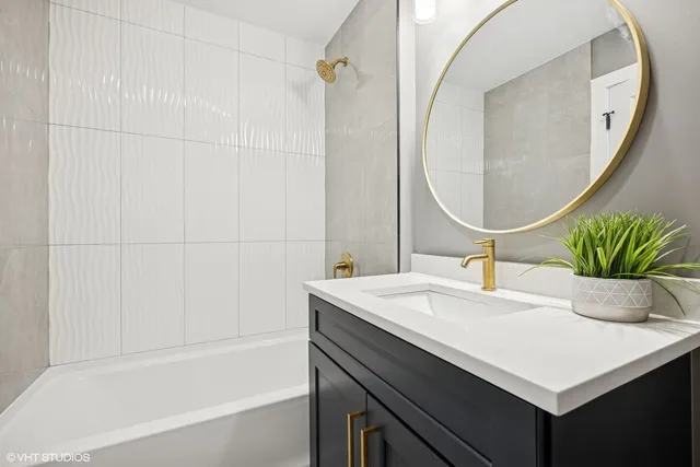 a bathroom with a sink a vanity and a mirror