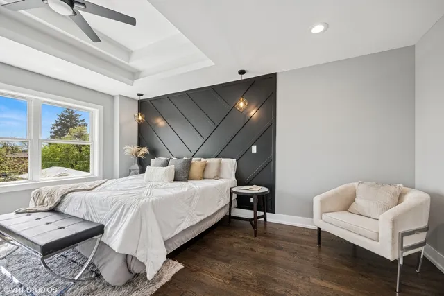 a bedroom with a bed and a couch