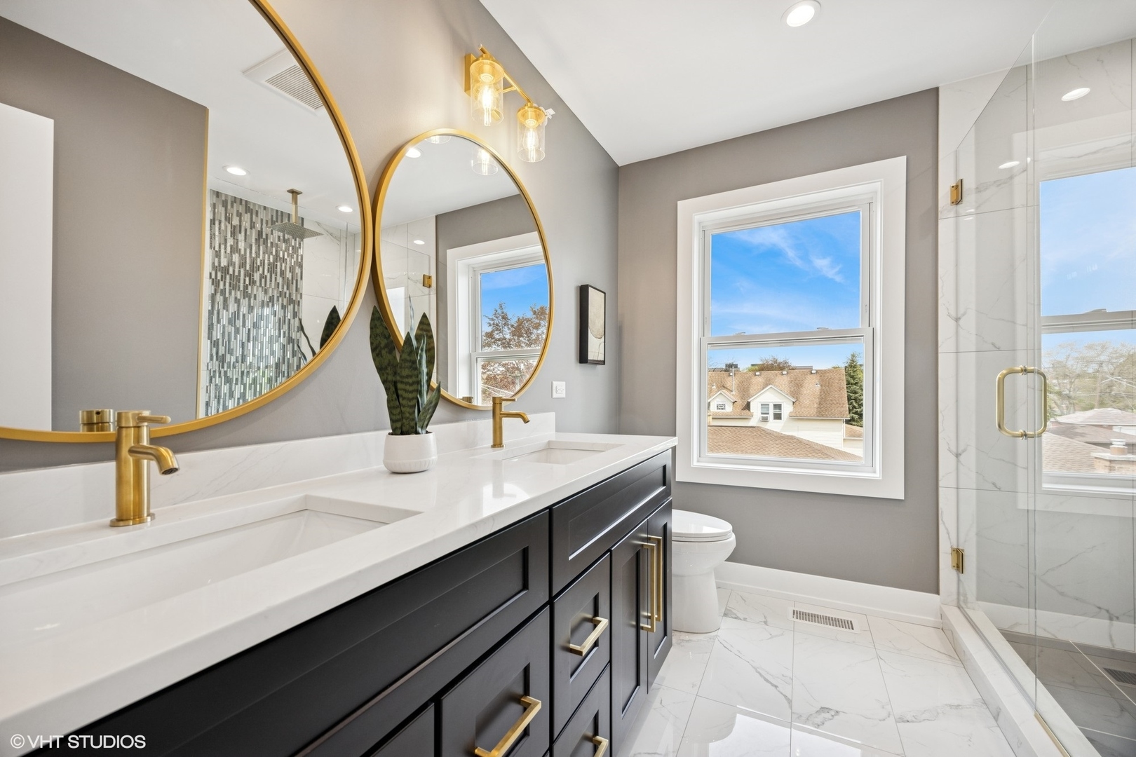 8524 Center Avenue River Grove, IL 60171 - Photo 25 of 38 a bathroom with a sink a toilet and mirror