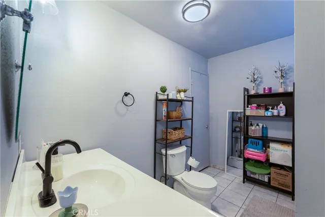 a bathroom with a toilet and a shower curtain