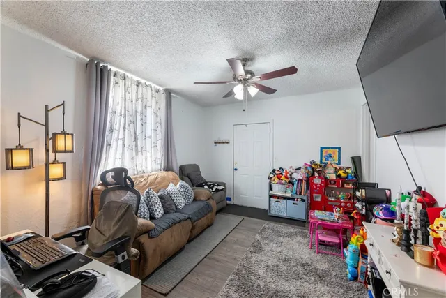a living room with lots of furniture and a window