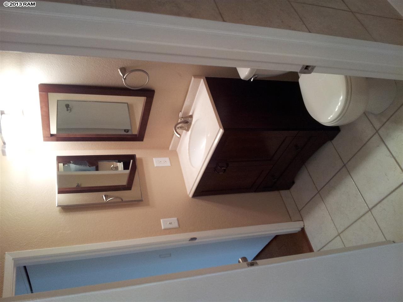 140 Uwapo Road, Unit 9104 Kihei, HI 96753 - Photo 14 of 27 a front view of a house with entryway