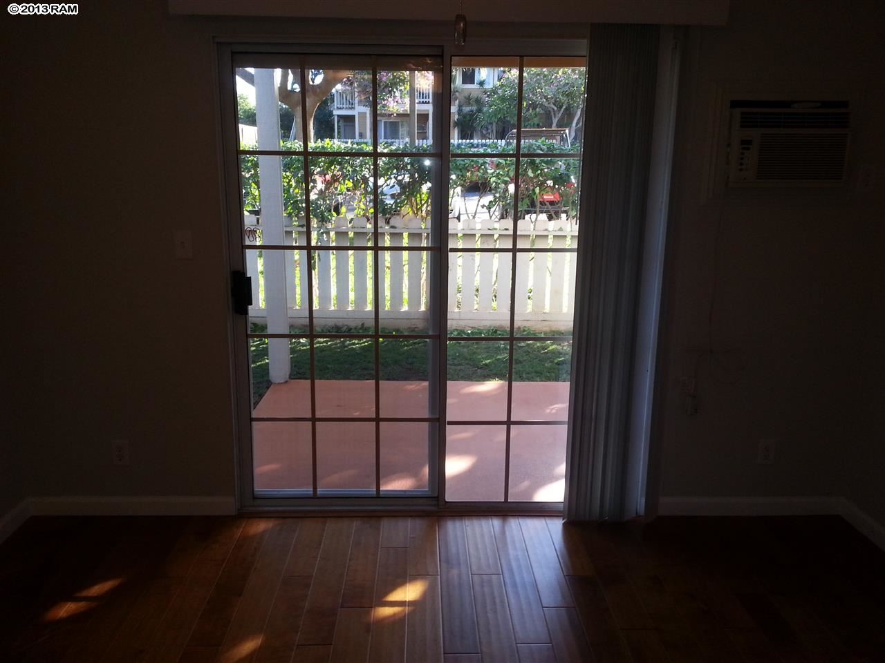 140 Uwapo Road, Unit 9104 Kihei, HI 96753 - Photo 22 of 27 a view of empty room with wooden floor and fan