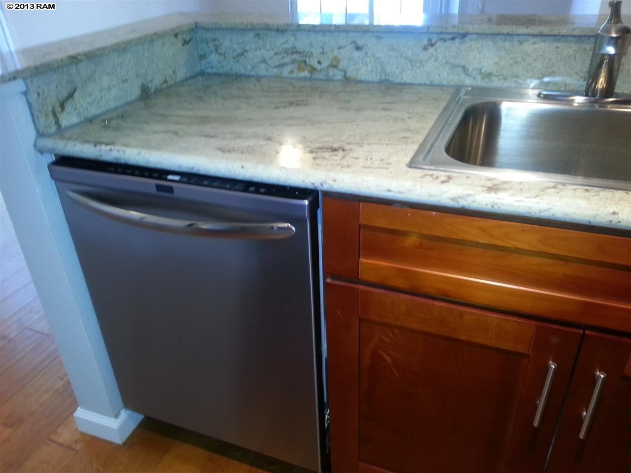 140 Uwapo Road, Unit 9104 Kihei, HI 96753 - Photo 8 of 27 a close view of sink and tap