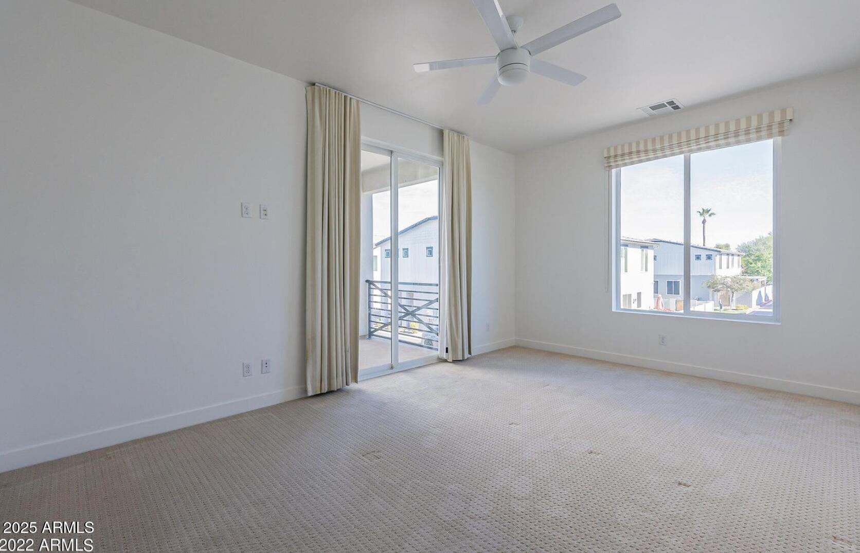 3030 North 38th Street, Unit 113 Phoenix, AZ 85018 - Photo 12 of 22 an empty room with windows and closet