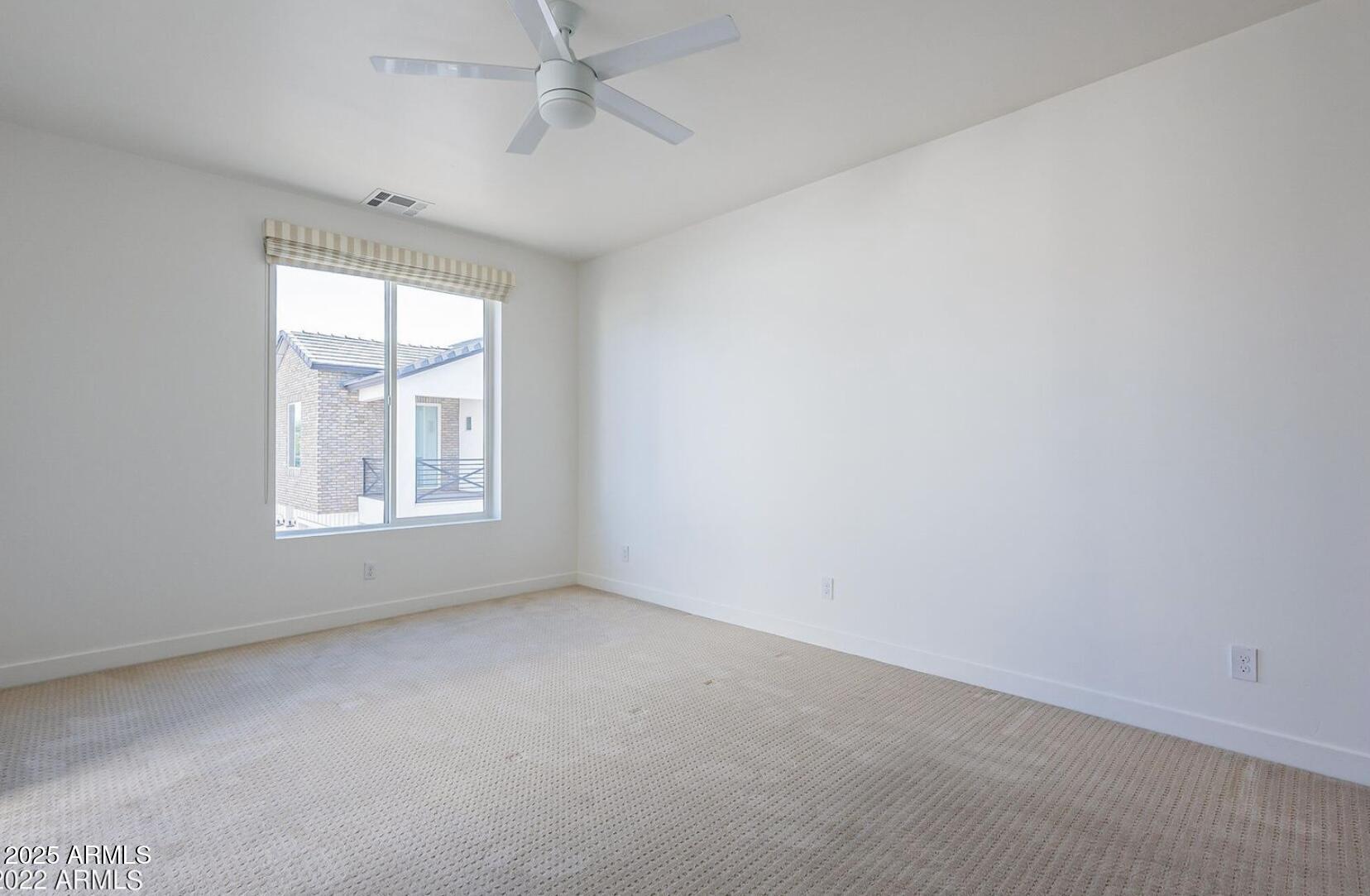 3030 North 38th Street, Unit 113 Phoenix, AZ 85018 - Photo 13 of 22 an empty room with a window