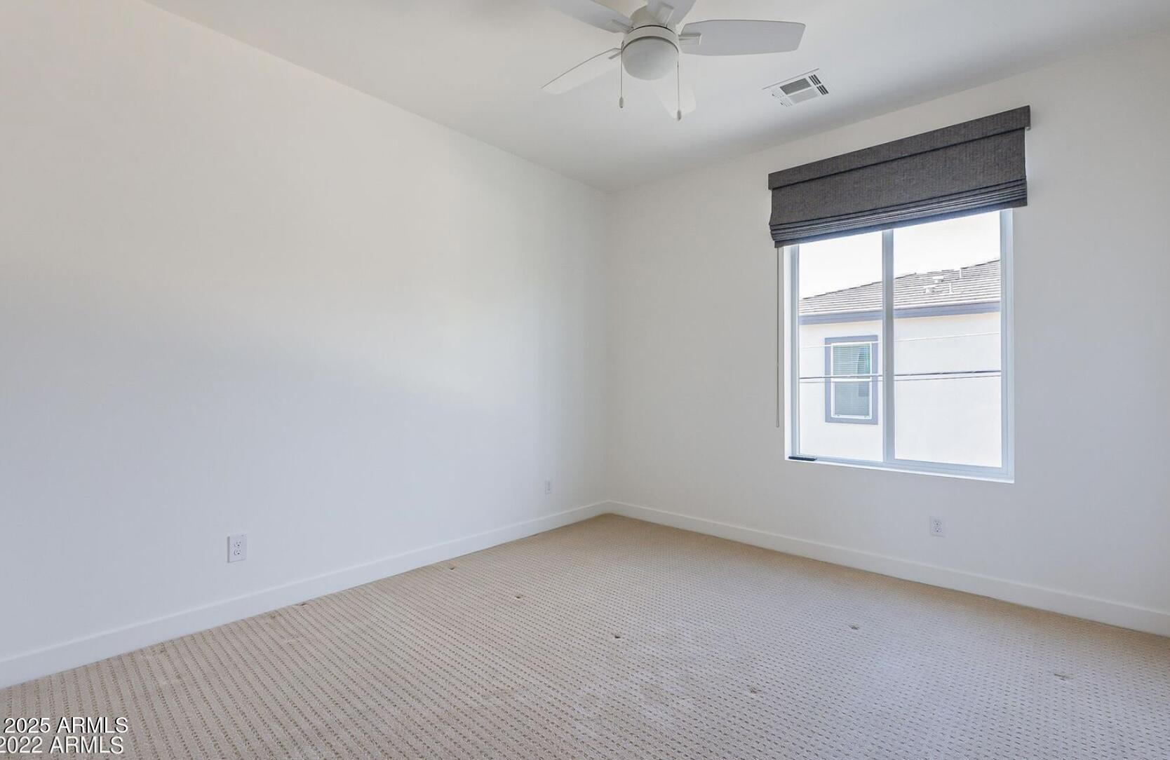 3030 North 38th Street, Unit 113 Phoenix, AZ 85018 - Photo 17 of 22 an empty room with a window