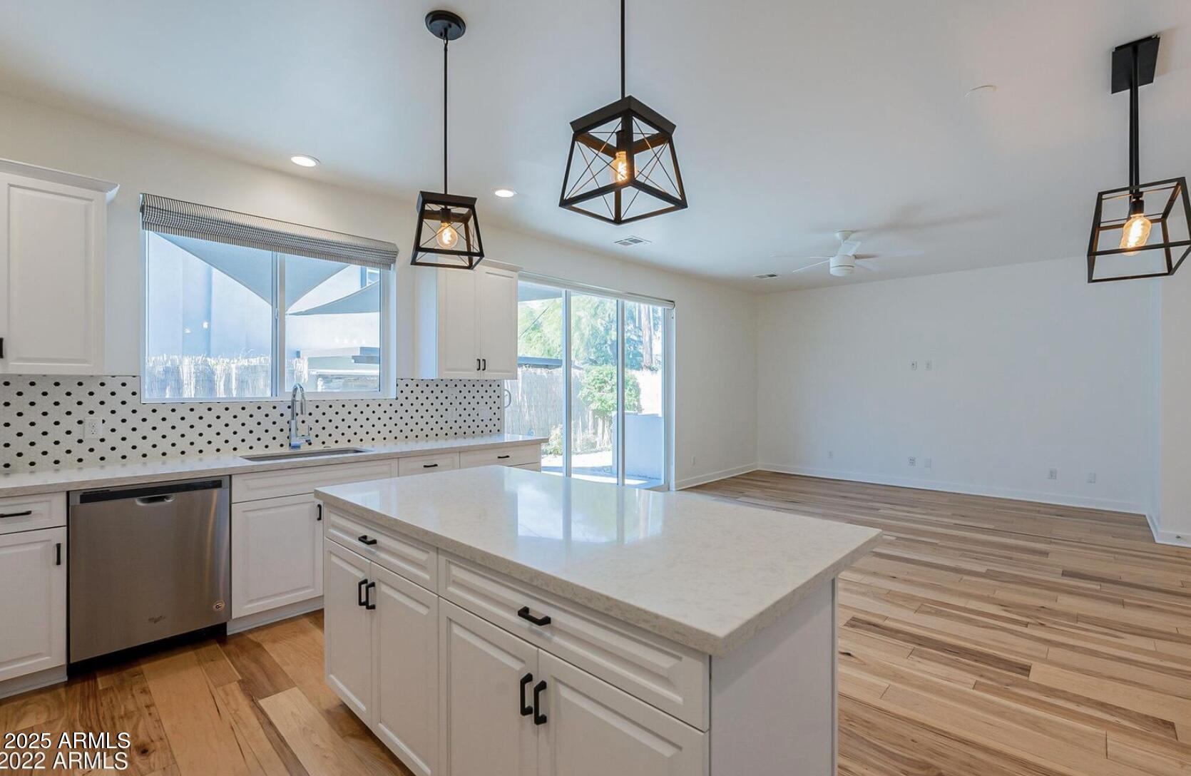 3030 North 38th Street, Unit 113 Phoenix, AZ 85018 - Photo 3 of 22 a kitchen with a cabinet a sink and a window