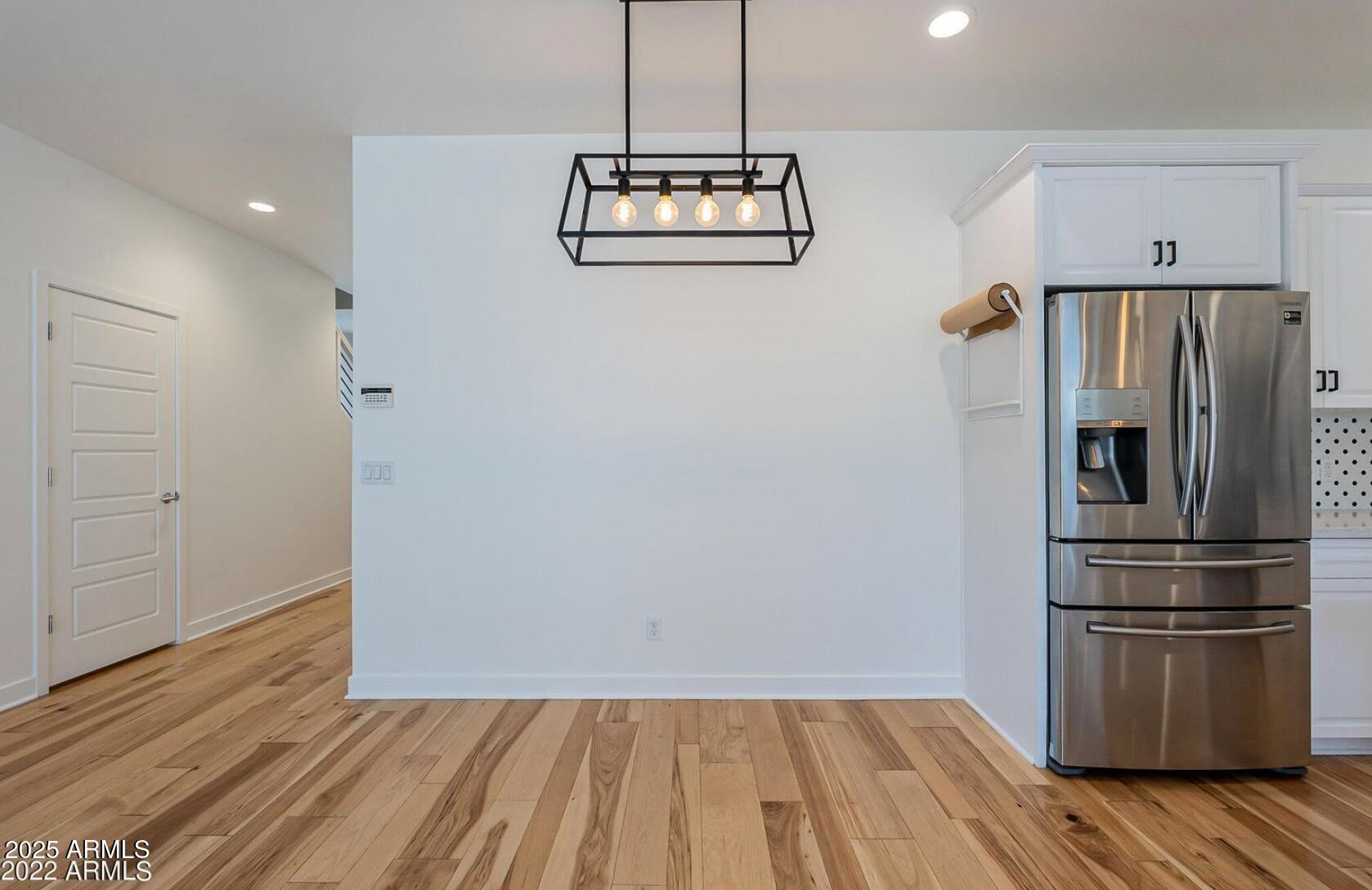 3030 North 38th Street, Unit 113 Phoenix, AZ 85018 - Photo 5 of 22 a kitchen with a refrigerator a stove and cabinets