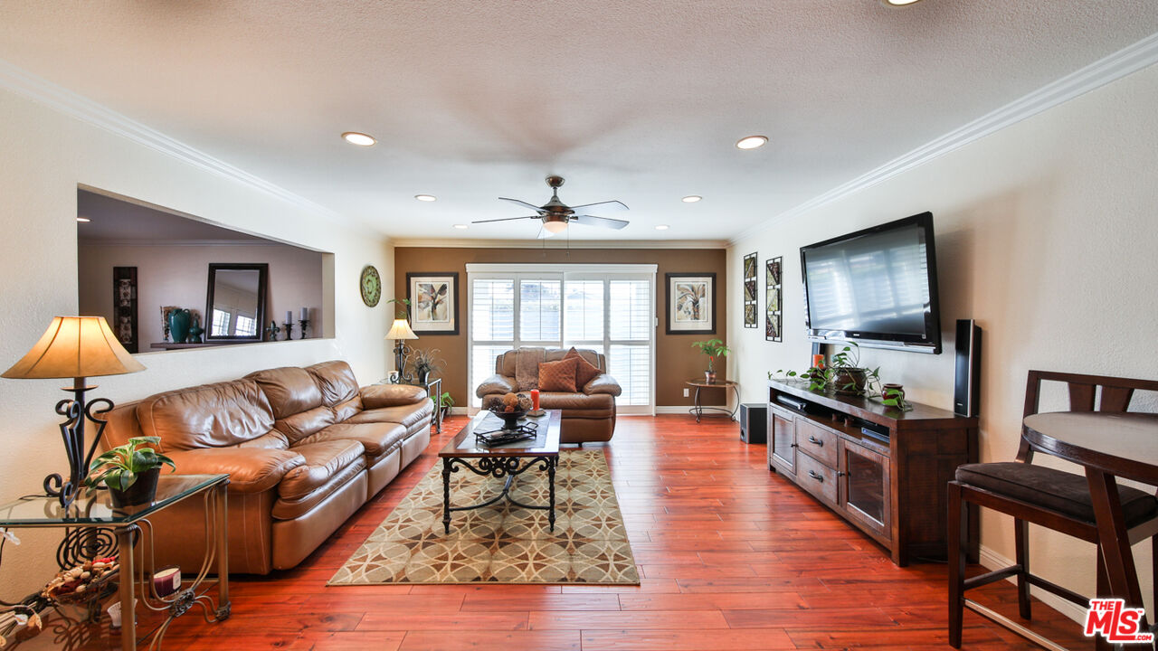 16953 Roa Drive Carson, CA 90746 - Photo 11 of 48 a living room with furniture and a flat screen tv