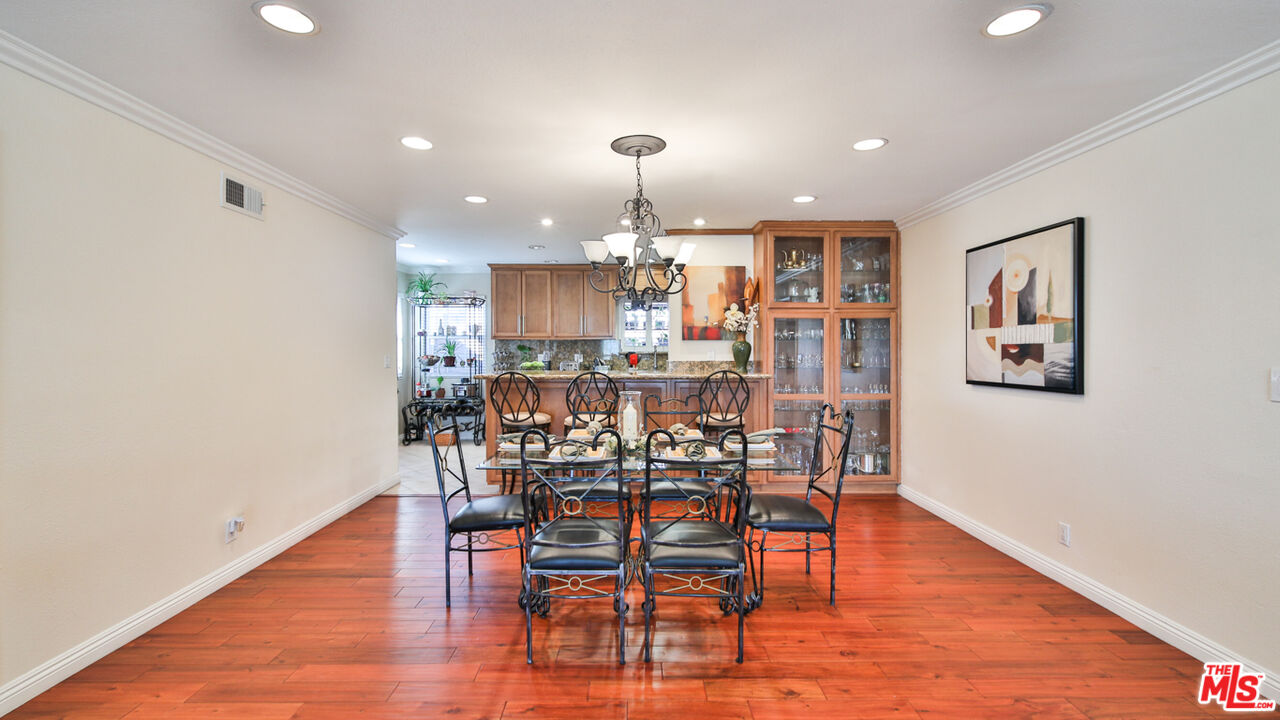 16953 Roa Drive Carson, CA 90746 - Photo 15 of 48 a dining room with furniture and wooden floor