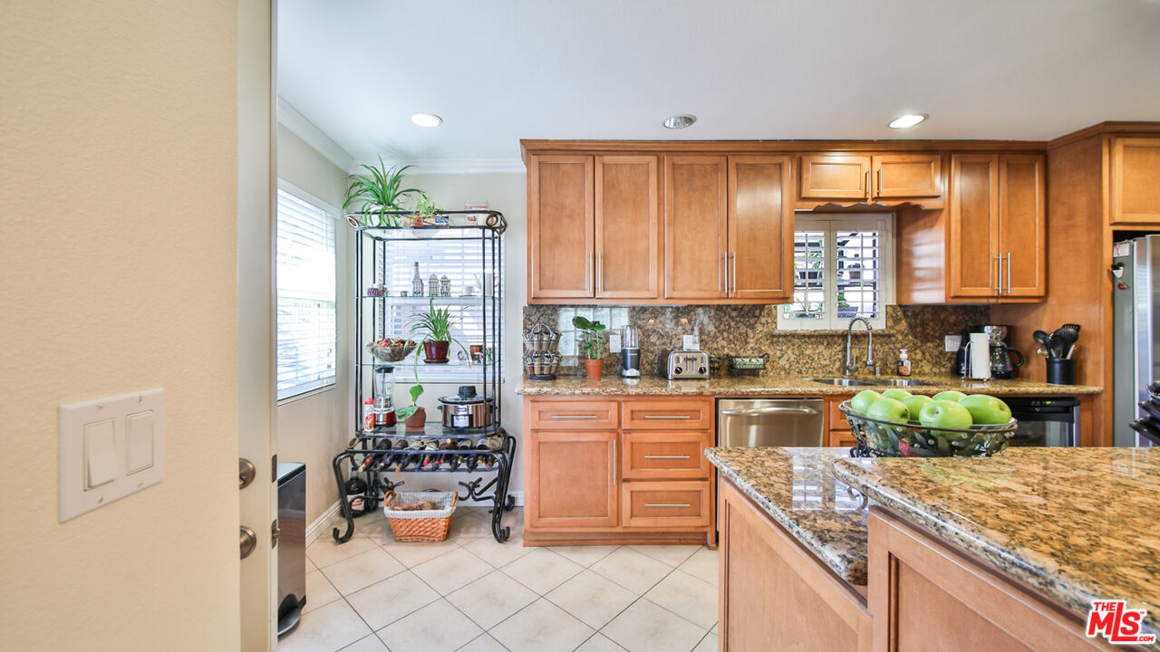 16953 Roa Drive Carson, CA 90746 - Photo 19 of 48 a kitchen with a refrigerator and a sink