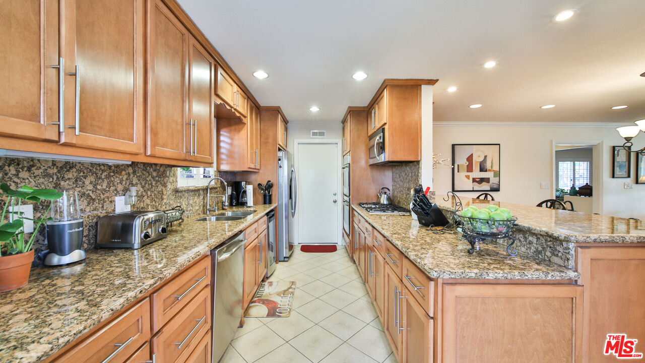 16953 Roa Drive Carson, CA 90746 - Photo 20 of 48 a kitchen with granite countertop lots of counter top space