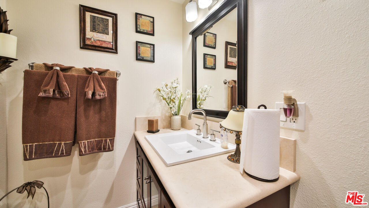 16953 Roa Drive Carson, CA 90746 - Photo 25 of 48 a bathroom with a sink and mirror