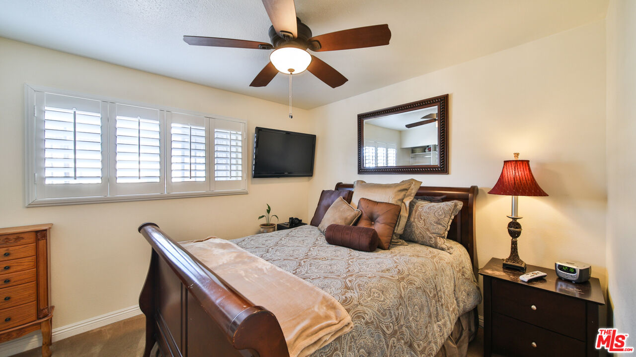 16953 Roa Drive Carson, CA 90746 - Photo 26 of 48 a bedroom with a bed and a flat screen tv
