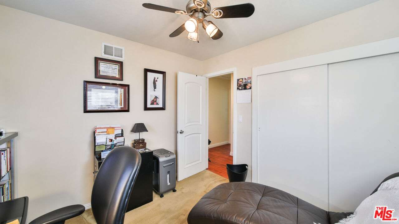16953 Roa Drive Carson, CA 90746 - Photo 32 of 48 a bedroom with furniture and a ceiling fan
