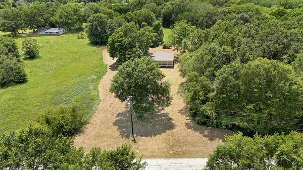a view of a lake with a yard