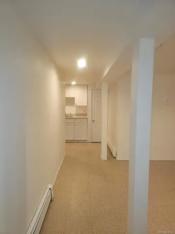 a kitchen with a sink a stove and cabinets