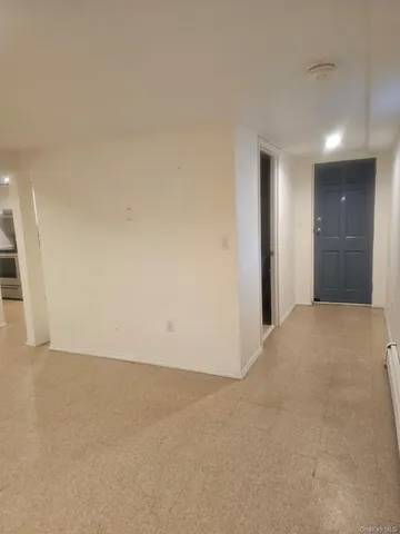 a view of a room with an empty space