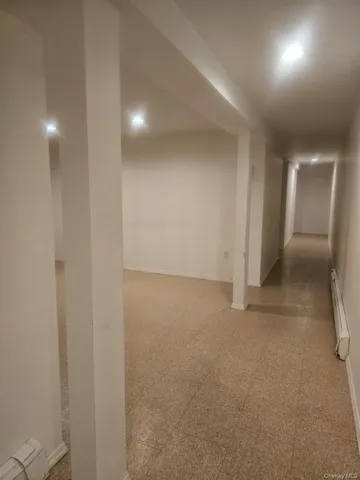 a view of an empty room and a window