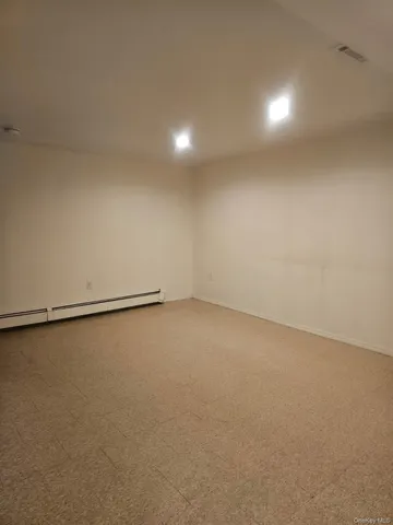 a bathroom with a shower a toilet and a sink