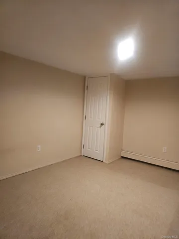 a bathroom with 2 sink shower and a mirror