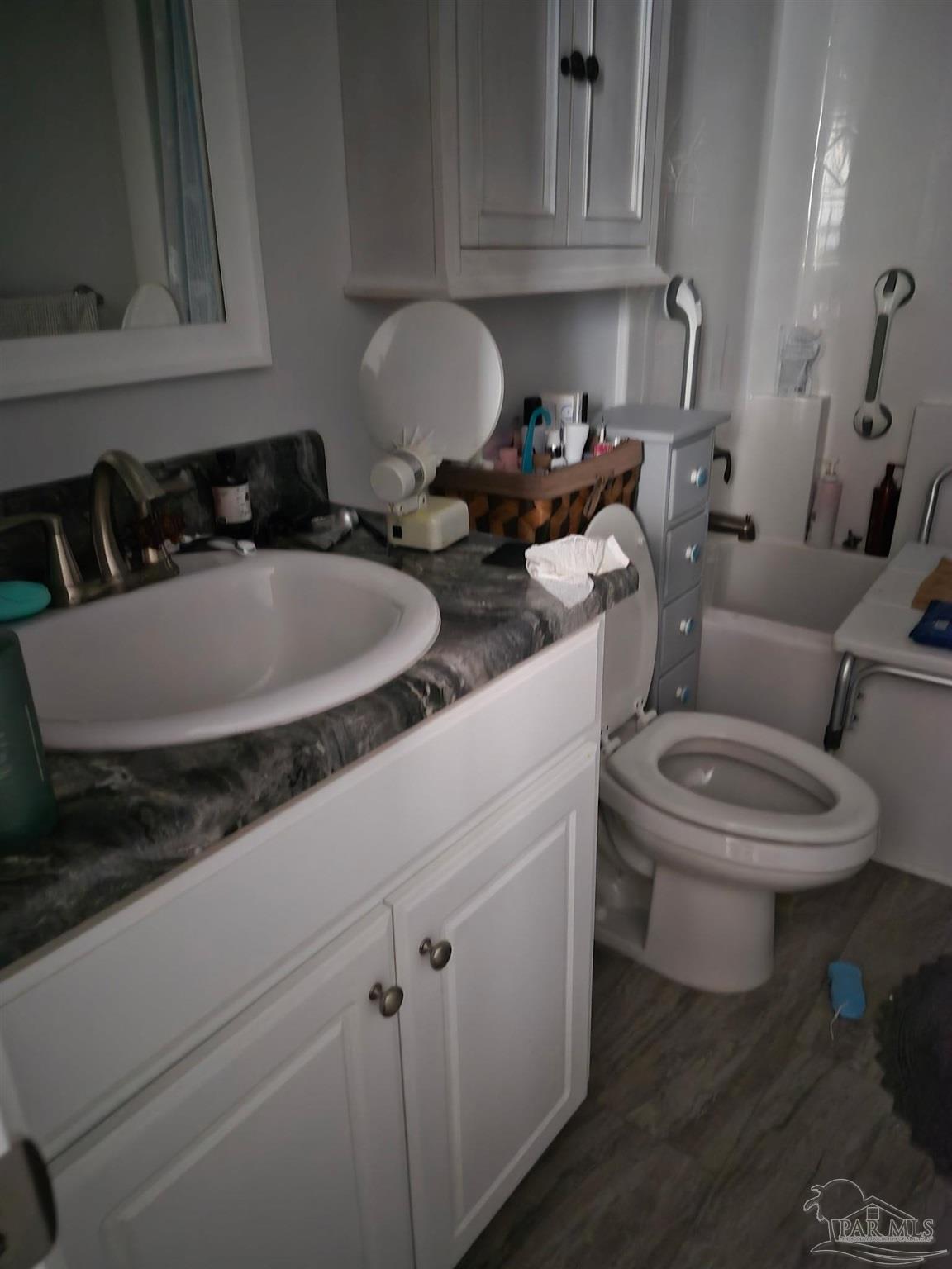 5538 Holley Street Milton, FL 32583 - Photo 5 of 6 a close view of a sink and a toilet
