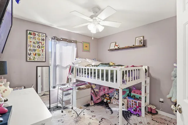 a bedroom with furniture and a window