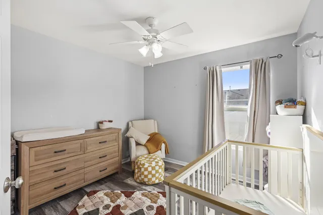 a view of bedroom with furniture and chandelier