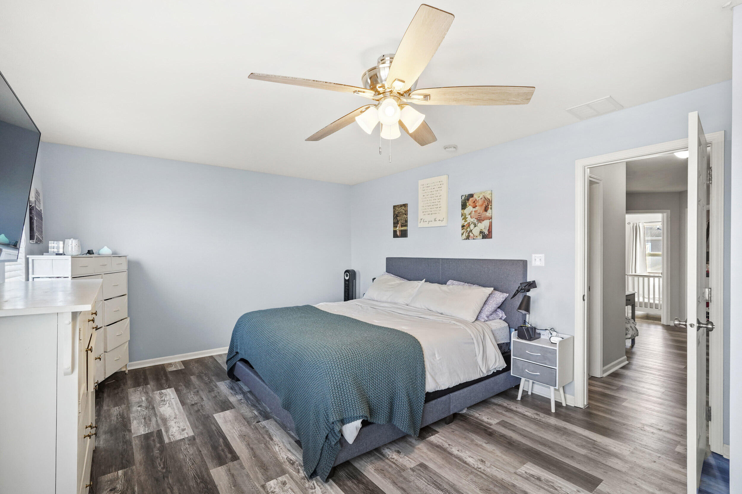10421 Paramount Way Cedar Lake, IN 46303 - Photo 19 of 26 a bedroom with a bed and wooden floor