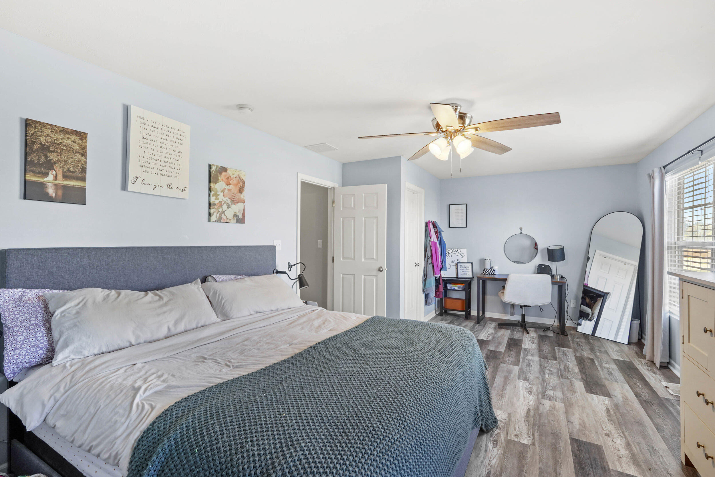 10421 Paramount Way Cedar Lake, IN 46303 - Photo 21 of 26 a bedroom with a bed and a chandelier