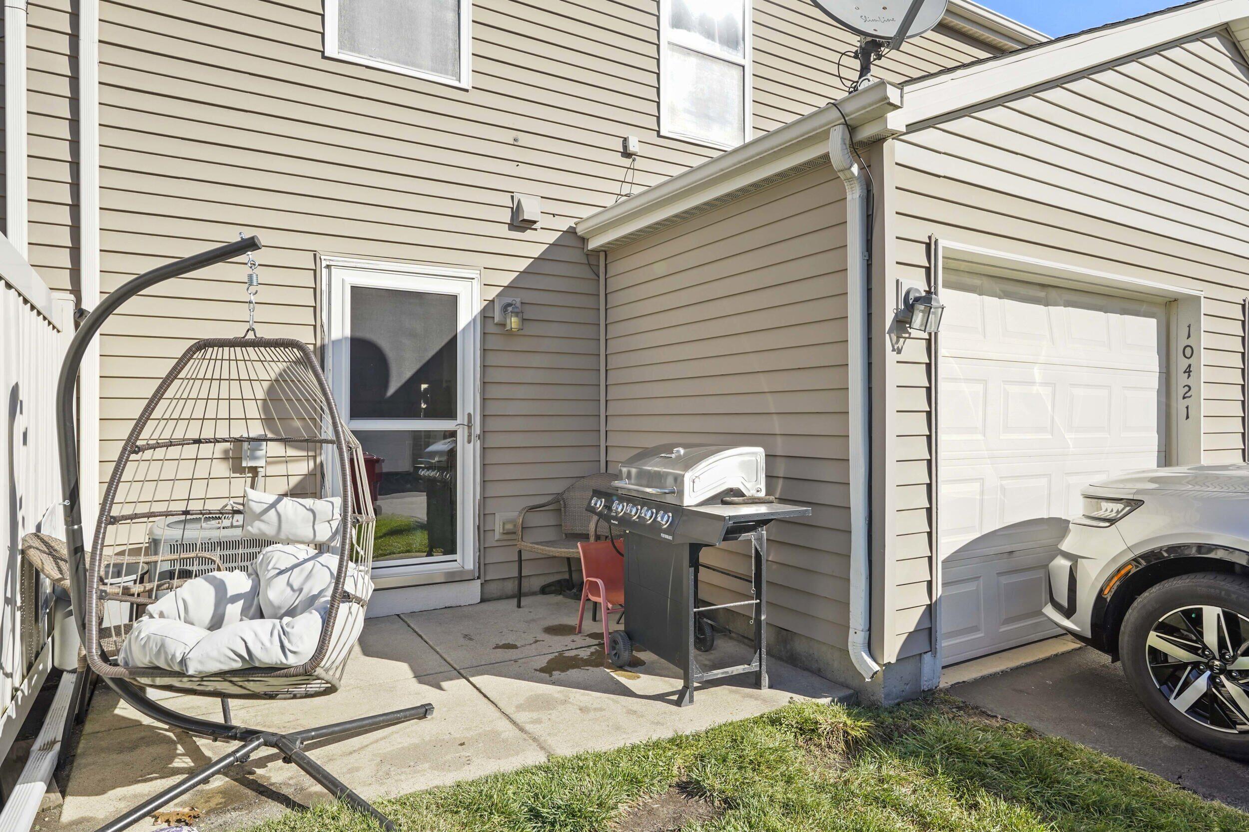 10421 Paramount Way Cedar Lake, IN 46303 - Photo 22 of 26 a view of a patio with table and chairs and potted plants