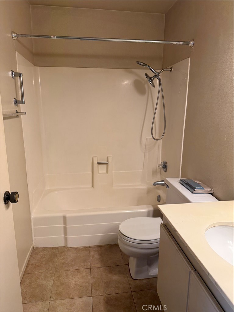 122 Tangelo Irvine, CA 92618 - Photo 24 of 34 a bathroom with a granite countertop sink toilet and shower