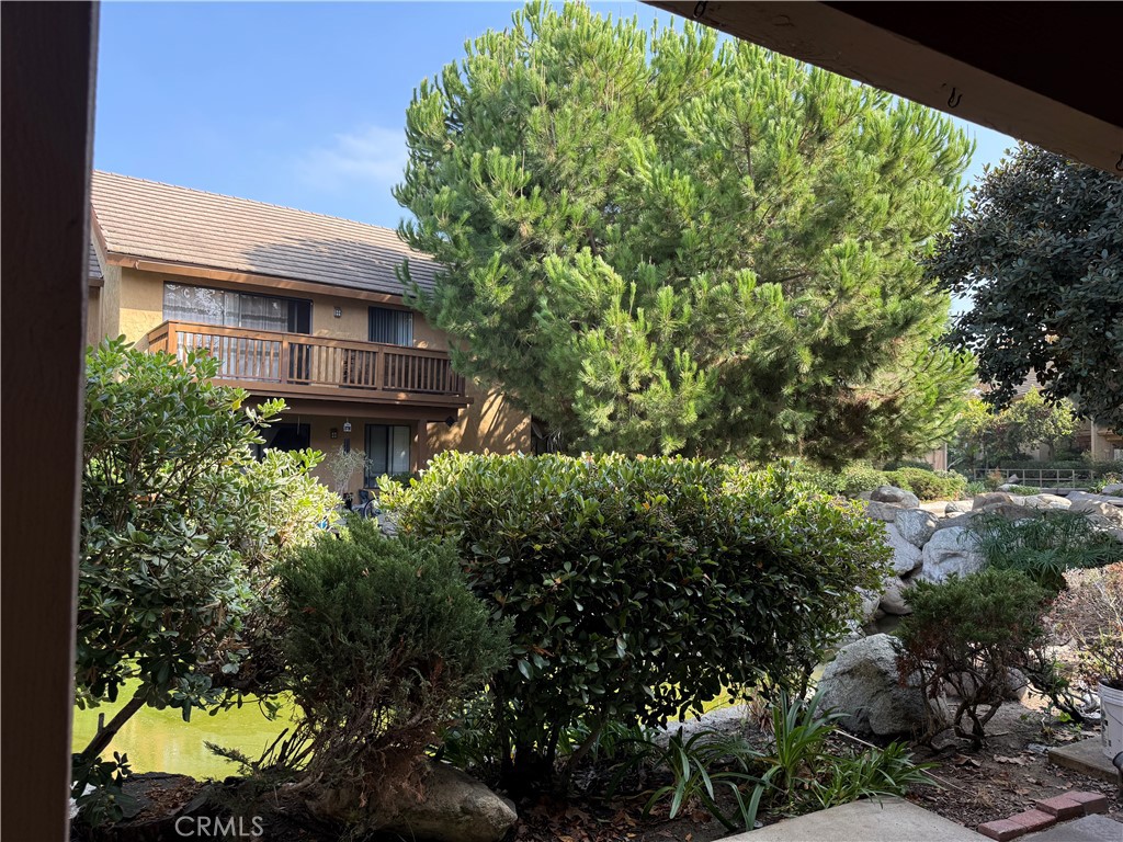 122 Tangelo Irvine, CA 92618 - Photo 29 of 34 a view of a house with a tree and a yard