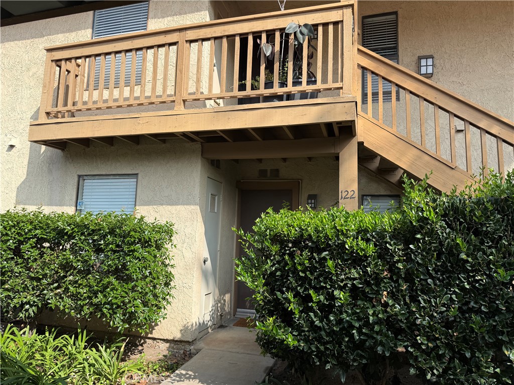 122 Tangelo Irvine, CA 92618 - Photo 3 of 34 a view of a house with large windows and flower plants