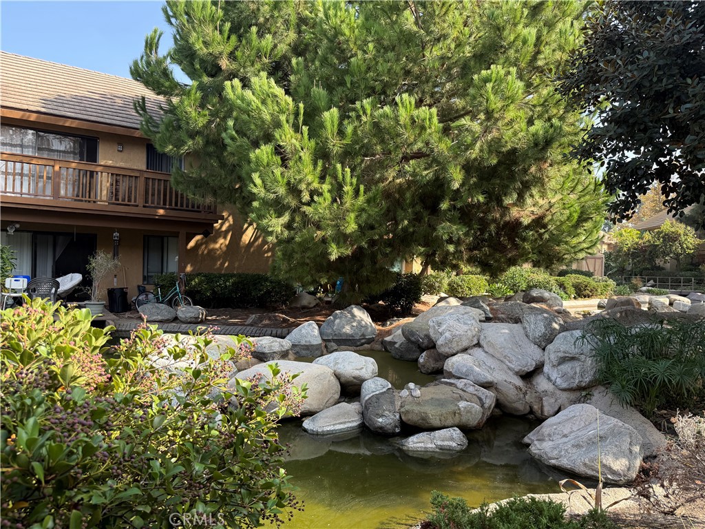 122 Tangelo Irvine, CA 92618 - Photo 31 of 34 a view of swimming pool with lawn chairs and plants