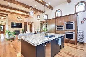 825 Grubbs Road Sealy, TX 77474 - Photo 12 of 49 a kitchen with stainless steel appliances granite countertop a kitchen island sink stove and refrigerator