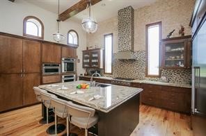 825 Grubbs Road Sealy, TX 77474 - Photo 13 of 49 a kitchen with a table chairs and chandelier