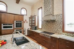 825 Grubbs Road Sealy, TX 77474 - Photo 15 of 49 a kitchen with sink stove and cabinets