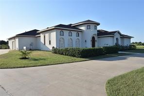 825 Grubbs Road Sealy, TX 77474 - Photo 2 of 49 a view of a house with a yard and plants