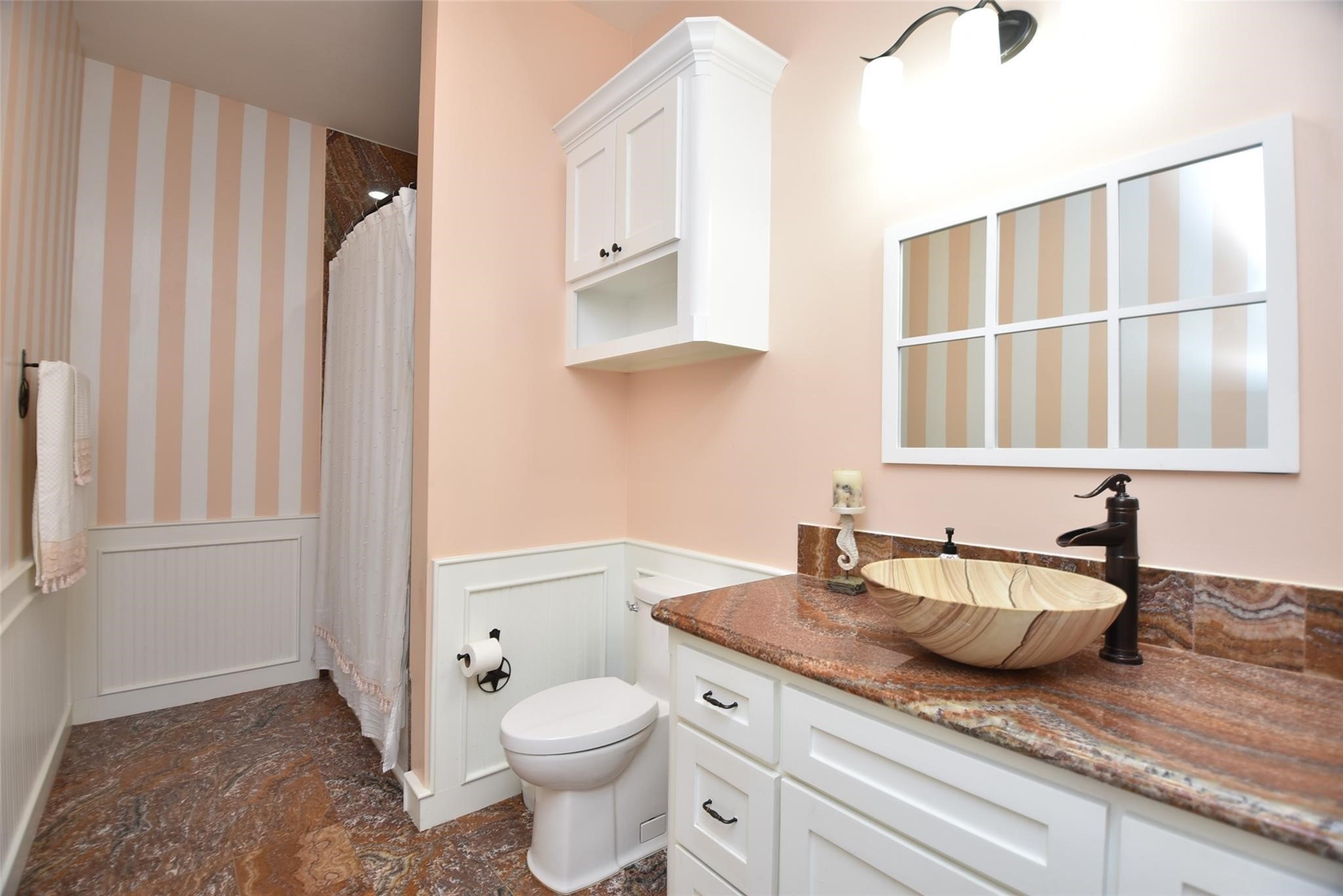 825 Grubbs Road Sealy, TX 77474 - Photo 28 of 49 a bathroom with a granite countertop sink a toilet and a mirror
