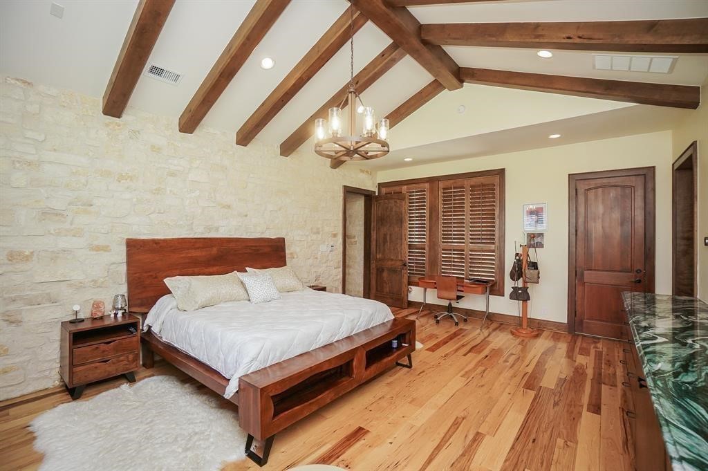 825 Grubbs Road Sealy, TX 77474 - Photo 30 of 49 a bedroom with a bed and wooden floor