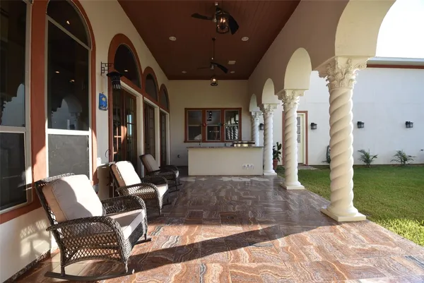 a living room with patio furniture