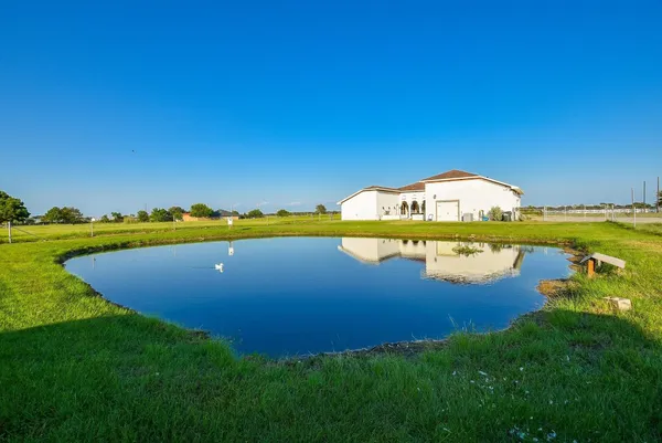 a view of a house with a big yard