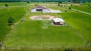 825 Grubbs Road Sealy, TX 77474 - Photo 49 of 49 a swimming pool with wooden deck and yard