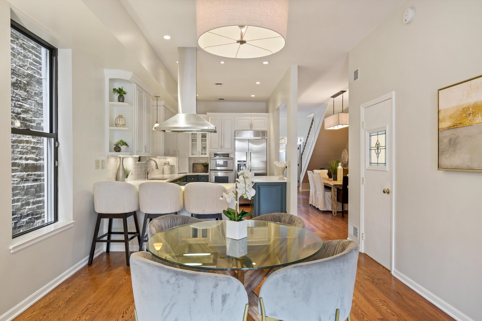1447 West Flournoy Street Chicago, IL 60607 - Photo 12 of 41 a living room with dining table furniture and a chandelier