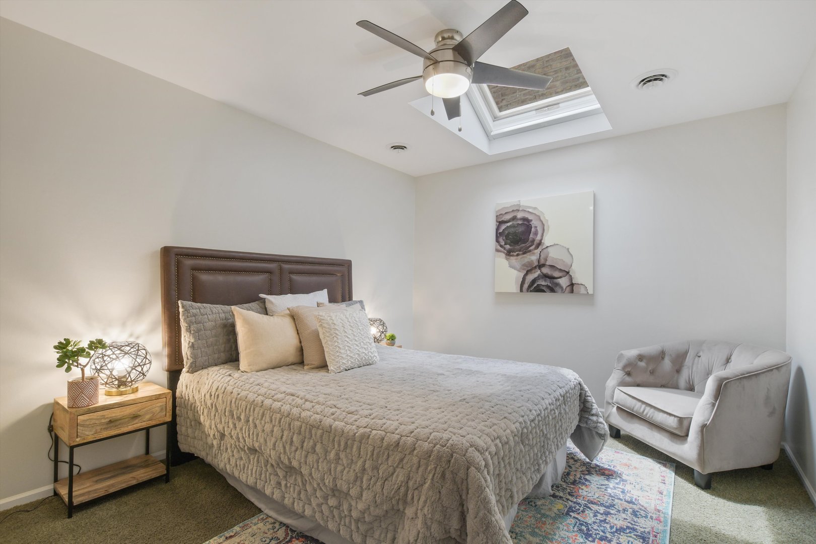 1447 West Flournoy Street Chicago, IL 60607 - Photo 21 of 41 a bedroom with a large bed and a couch
