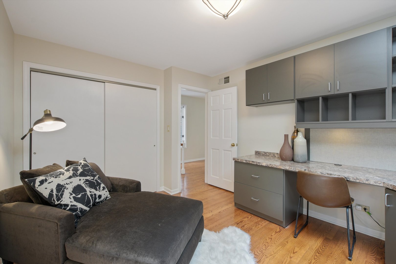 1447 West Flournoy Street Chicago, IL 60607 - Photo 24 of 41 a bedroom with a bed and a desk