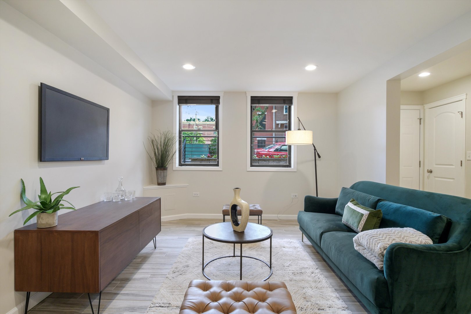 1447 West Flournoy Street Chicago, IL 60607 - Photo 26 of 41 a living room with furniture a flat screen tv and a window